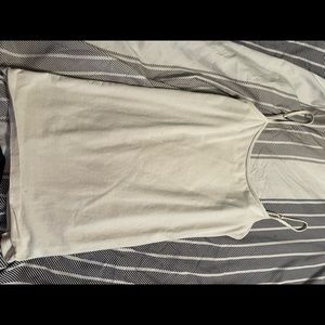 4 white tank tops